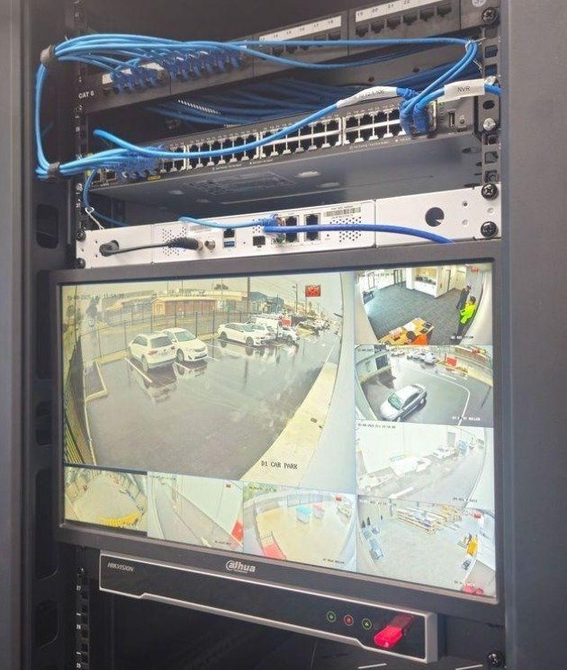 Camera recorder, network switches and CCTV playback monitor inside an equipment rack